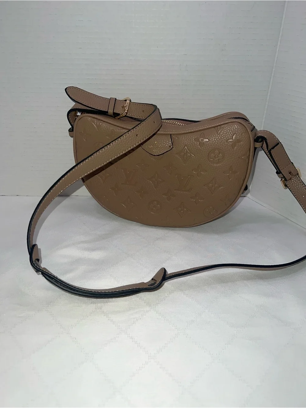 Designer inspired half-moon shoulder bag in a neutral taupe leather w/monogram